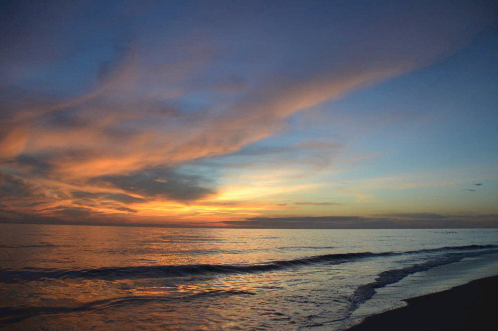 Arrive early to enjoy a serene sunrise or stay late to witness a stunning sunset over the horizon